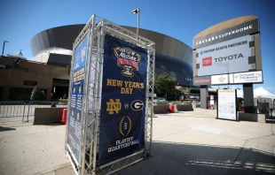 A sign for the Allstate Sugar Bowl between Georgia and Notre Dame is seen outside the Louisiana Superdome after at least 15 people were killed on Bourbon Street in a terror attack in the early morning hours of Jan. 1, 2025, in New Orleans. The game was postponed and rescheduled for Thursday, Jan. 2. Credit: Chris Graythen/Getty Images