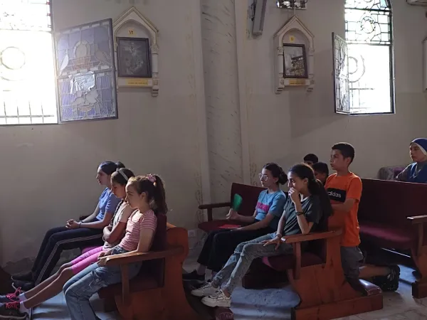 A group of teenagers listens during a training session in the Latin Church of the Holy Family in Gaza. Religious education and catechism are dedicated to the afternoon time and oratory activities. Credit: Photo courtesy of Father Gabriel Romanelli