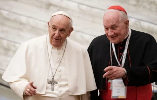 Pope Francis arrives with Cardinal Marc Ouellet (R) of Canada for the opening of three-day Symposium on priesthood in the Paul VI hall at the Vatican on Feb. 17, 2022. Tiziana Fabi/AFP via Getty Images)