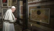 Pope Francis prays near the tomb of Father Pedro Arrupe, SJ, superior general of the Society of Jesus between 1965 and 1981, during a Mass at the Jesuit Church of the Most Holy Name of Jesus, known as the “Gesu” in Rome, Italy, on March 12, 2022, on the 400th anniversary of the canonization of St. Ignatius of Loyola, the society’s founder.