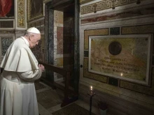 Pope Francis prays near the tomb of Father Pedro Arrupe, SJ, superior general of the Society of Jesus between 1965 and 1981, during a Mass at the Jesuit Church of the Most Holy Name of Jesus, known as the “Gesu” in Rome, Italy, on March 12, 2022, on the 400th anniversary of the canonization of St. Ignatius of Loyola, the society’s founder.