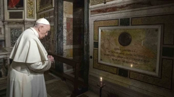 Pope Francis prays near the tomb of Father Pedro Arrupe, SJ, superior general of the Society of Jesus between 1965 and 1981, during a Mass at the Jesuit Church of the Most Holy Name of Jesus, known as the “Gesu” in Rome, Italy, on March 12, 2022, on the 400th anniversary of the canonization of St. Ignatius of Loyola, the society’s founder.