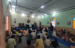 A missionary priest of the Order of St. Elijah celebrates a Mass attended by Christians liberated from slavery in a small chapel in Pakistan. Credit: Courtesy of Order of St. Elijah