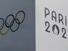 A banner bears the signs of the 2024 Paris Olympic Games and the Olympic Rings at the Trocadero in Paris on July 14, 2024.