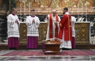 Pope Francis blesses the coffin of Cardinal George Pell at the Australian prelate's funeral Mass in St. Peter's Basilica on Jan. 14, 2023. Vatican Media