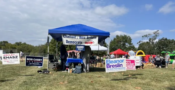 Local Democrats operate a booth at the New Britain Township Veterans Committee Fall Festival and Car Show in Bucks County, Pennsylvania, on Sept. 21, 2024. Credit: Tyler Arnold/CNA