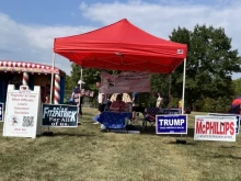 Local Republicans operate a booth at the New Britain Township Veterans Committee Fall Festival and Car Show in Bucks County, Pennsylvania, on Sept. 21, 2024.