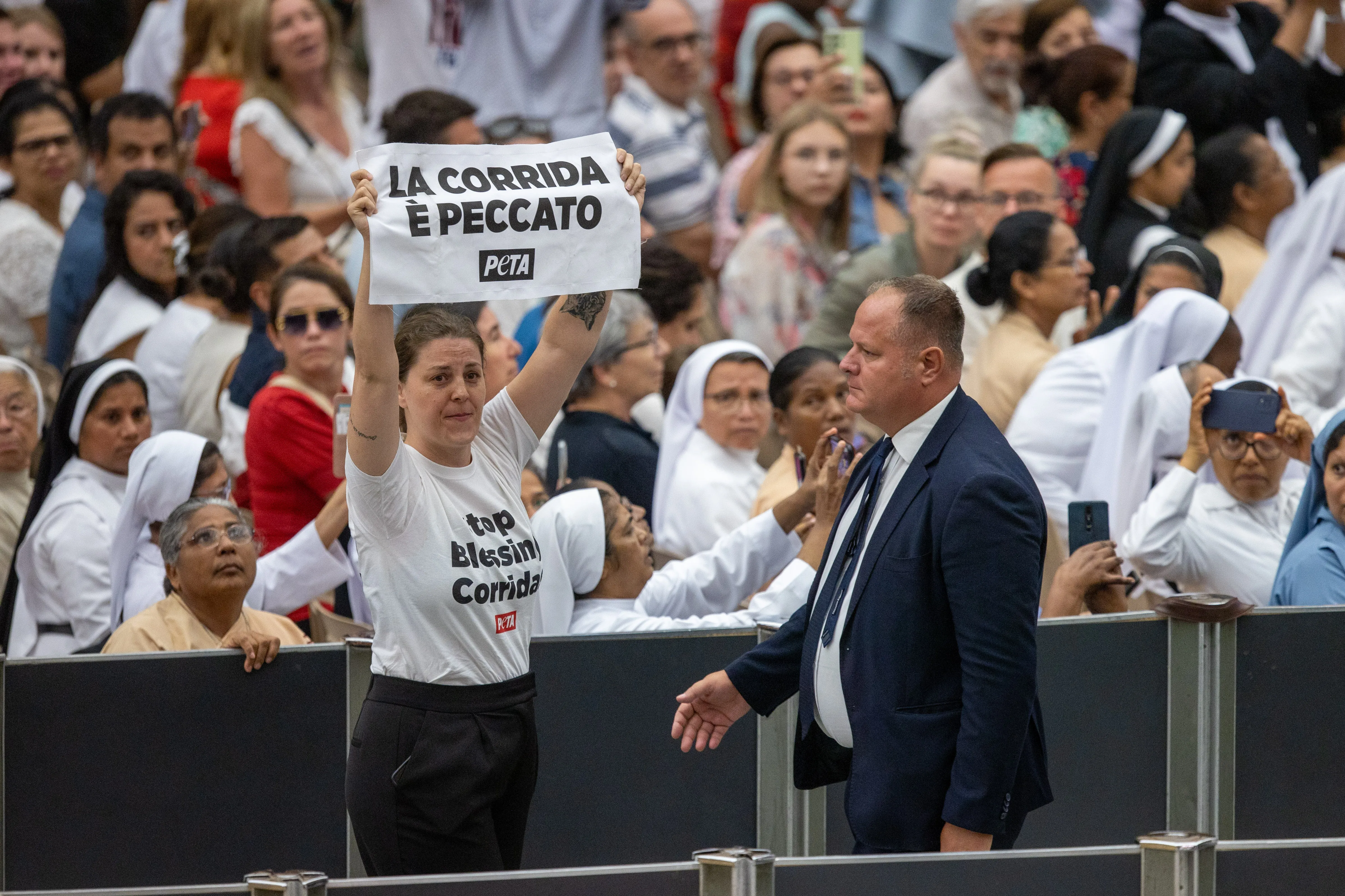 An activist from PETA (People for the Ethical Treatment of Animals) holds a sign that reads “la corrida e peccato” (“bullfighting is a sin”), temporarily interrupted Pope Francis’ catechesis during his Wednesday general audience on Aug. 7, 2024.?w=200&h=150