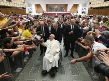 Pope Francis greets participants in a gathering of choir singers, musicians, and directors at Paul VI Hall at the Vatican on June 8, 2024.