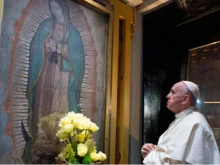 Pope Francis prays before an image of Our Lady of Guadalupe.