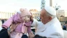 Pope Francis blessing a baby during a general audience.