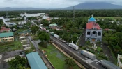 An aerial view shows a long line of trucks stranded along a flooded highway caused by heavy rains brought about by Tropical Storm Trami in Nabua town, Camarines Sur province, South of Manila, Philippines, on Oct. 23, 2024.