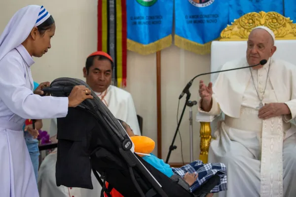 Pope Francis blesses a disabled child at the Irmas Alma School in Timor-Leste on Tuesday, Sept. 10, 2024. Credit: Daniel Ibáñez/CNA