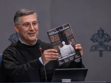 Father Enzo Fortunato, OFM Conv., communications director for St. Peter’s Basilica, holds up a copy of the first issue of the Vatican's new monthly magazine, “Piazza San Pietro.”