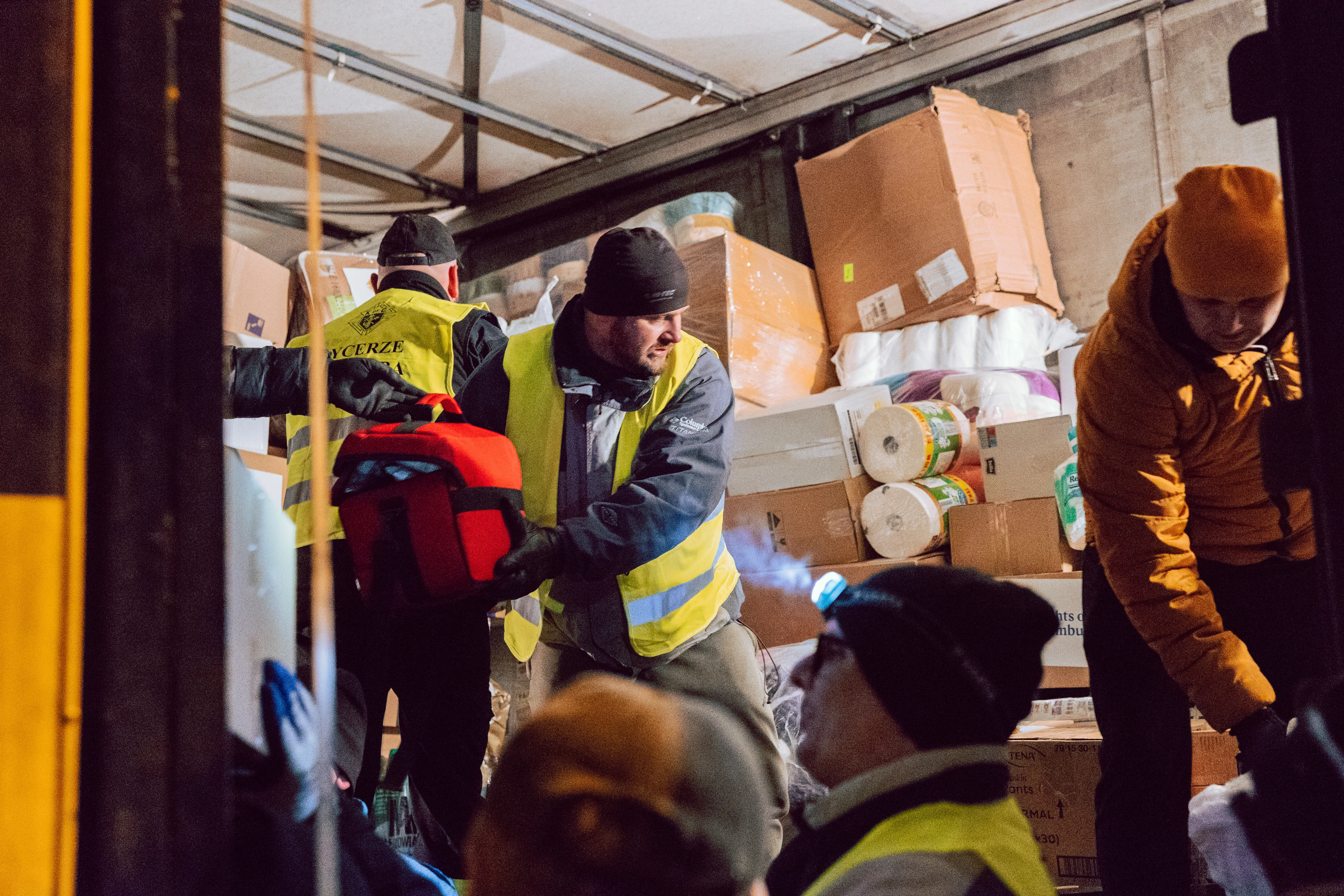 Polish Knights of Columbus unload a truck full of supplies for refugees fleeing Ukraine.?w=200&h=150