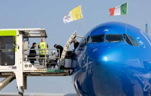 Pope Francis prepares to board an ITA Airlines plane for his approximately 10-hour flight from Rome to Edmonton in western Canada on July 24, 2022. Daniel Ibañez/CNA