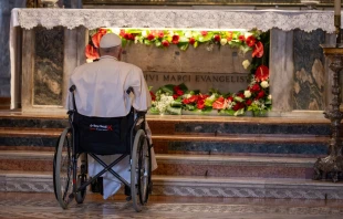 Pope Francis prays in front of the tomb of St. Mark the Evangelist inside St. Mark's Basilica in Venice on April 28, 2024. Credit: Daniel Ibañez/CNA