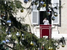 Pope Francis leads the Angelus prayer and delivers an address from a window in the Apostolic Palace on Dec. 26, 2024, at the Vatican.