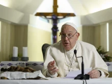 Pope Francis leads the Angelus prayer and gives an address from the chapel of Casa Santa Marta on Sunday, Dec. 22, 2024, at the Vatican. The pope delivered his marks indoors due to the intense cold, combined with cold symptoms that have manifested in recent days, the Holy See Press Office said.