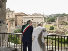 Pope Francis gazes over the ancient ruins of the Roman Forum with Rome Mayor Roberto Gualtieri during a visit to Rome’s historic Capitoline Hill on June 10, 2024.