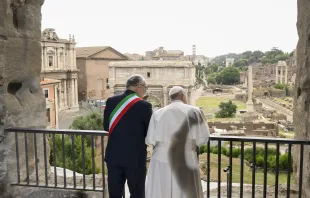 Pope Francis gazes over the ancient ruins of the Roman Forum with Rome Mayor Roberto Gualtieri during a visit to Rome’s historic Capitoline Hill on June 10, 2024. Credit: Vatican Media