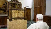 Pope Francis views a historic relic of the chair of St. Peter on Oct. 2, 2024.