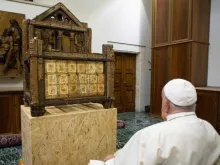 Pope Francis views a historic relic of the chair of St. Peter on Oct. 2, 2024.