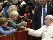 Pope Francis greets pilgrims gathered for Mass on the solemnity of the Epiphany on Jan. 6, 2025, in St. Peter’s Basilica at the Vatican.