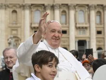 Pope Francis waves to pilgrims gathered in St. Peter’s Square during his general audience on Wednesday, June 19, 2024.