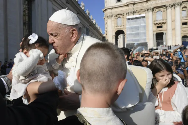 Pope Francis kisses a baby during his general audience in St. Peter’s Square on Wednesday, Aug. 28, 2024. Credit: Vatican Media