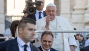 Pope Francis waves to pilgrims as he enters St. Peter’s Square at the Vatican for his Wednesday general audience on Oct. 30, 2024.