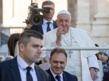 Pope Francis waves to pilgrims as he enters St. Peter’s Square at the Vatican for his Wednesday general audience on Oct. 30, 2024.