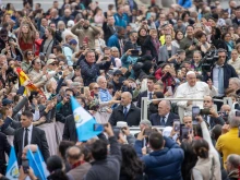 Pope Francis greets pilgrims gathered in St. Peter’s Square for his Wednesday general audience on Nov. 20, 2024, at the Vatican.