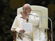 Pope Francis waves to the crowd in the Paul VI Audience Hall at the Vatican during his Wednesday general audience on Jan. 22, 2025.