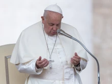 Pope Francis prays during his Wednesday general audience in St. Peter’s Square at the Vatican on Oct. 9, 2024.