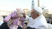 Pope Francis blesses a toddler during his general audience on Wednesday, Dec. 4, 2024, in St. Peter’s Square.