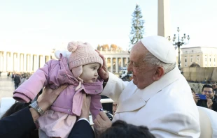 Pope Francis blesses a toddler during his general audience on Wednesday, Dec. 4, 2024, in St. Peter’s Square. Credit: Vatican Media