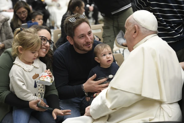 Pope Francis greets a young family in attendance at his general audience on Wednesday, Jan. 8, 2025, in Paul VI Hall at the Vatican. Credit: Vatican Media