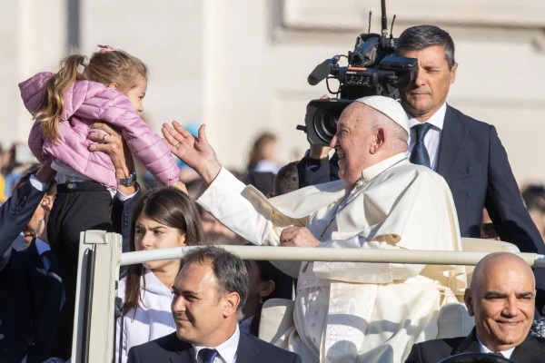 Pope Francis receives a youngster for a blessing during his Wednesday general audience on Oct. 30, 2024, in St. Peter’ Square at the Vatican. Credit: Daniel Ibañez/CNA