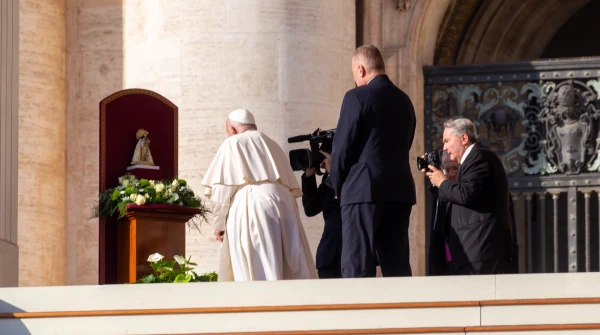 Pope Francis venerates a statue of the Virgen de los Desamparados, “Our Lady who takes care of the poor, patroness of Valencia, [Spain],” in St. Peter’s Square during his Wednesday general audience on Nov. 6, 2024, at the Vatican. Credit: Julia Cassell/CNA