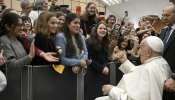 Pope Francis greets young people gathered for his general audience on Wednesday, Jan. 8, 2025, in Paul VI Hall at the Vatican.