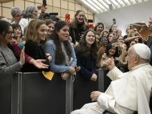 Pope Francis greets young people gathered for his general audience on Wednesday, Jan. 8, 2025, in Paul VI Hall at the Vatican.