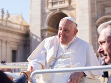 Pope Francis shakes hands with pilgrims gathered in St. Peter’s Square for his Wednesday general audience on Nov. 6, 2024, at the Vatican.