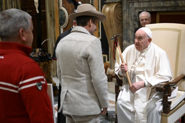 Pope Francis is presented with a pickaxe, a symbol of a mountain climber’s tools, during a meeting with the delegations of the Diocese of Aosta, Italy, and the Congregation of the Canons of Great Saint Bernard on Nov. 11, 2024, in the Apostolic Palace at the Vatican. Credit: Vatican Media