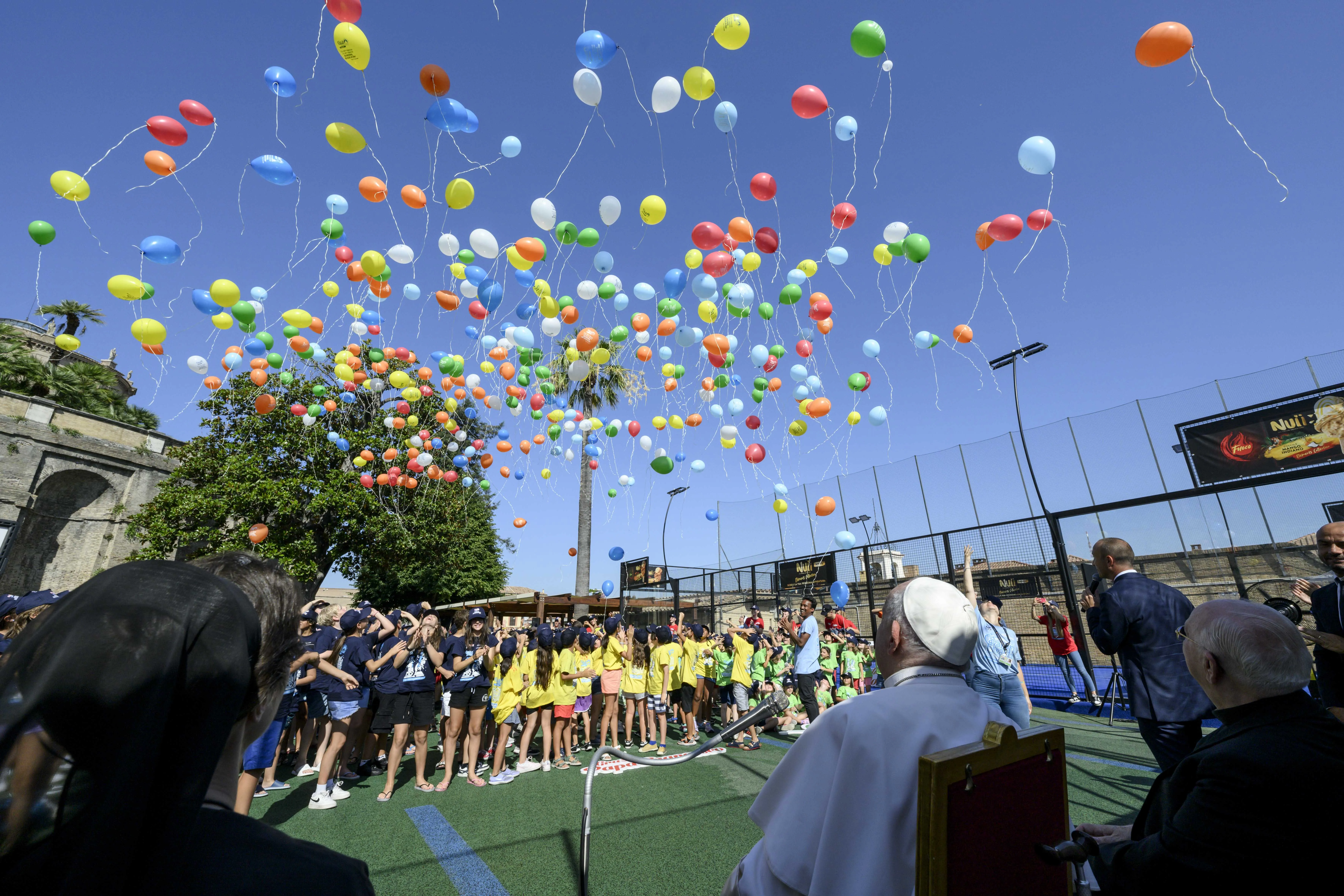 The kids and Pope Francis released biodegradable balloons into the sky together on July 18, 2024. The Vatican said the message, “You, dear boy, dear girl, are precious in God’s eyes,” was stamped on the balloons “with the hope that the message will reach as many people as possible.”?w=200&h=150