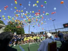 The kids and Pope Francis released biodegradable balloons into the sky together on July 18, 2024. The Vatican said the message, “You, dear boy, dear girl, are precious in God’s eyes,” was stamped on the balloons “with the hope that the message will reach as many people as possible.”