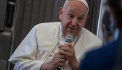 Pope Francis speaks to journalists aboard the papal plane during an in-flight press conference on Friday, Sept. 13, 2024, on his return from his nearly two-week tour of Southeast Asia.