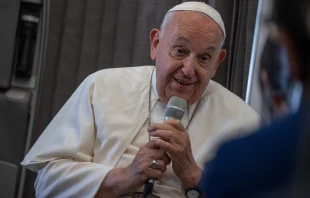 Pope Francis speaks to journalists aboard the papal plane during an in-flight press conference on Friday, Sept. 13, 2024, on his return from his nearly two-week tour of Southeast Asia. Credit: Daniel Ibañez/CNA