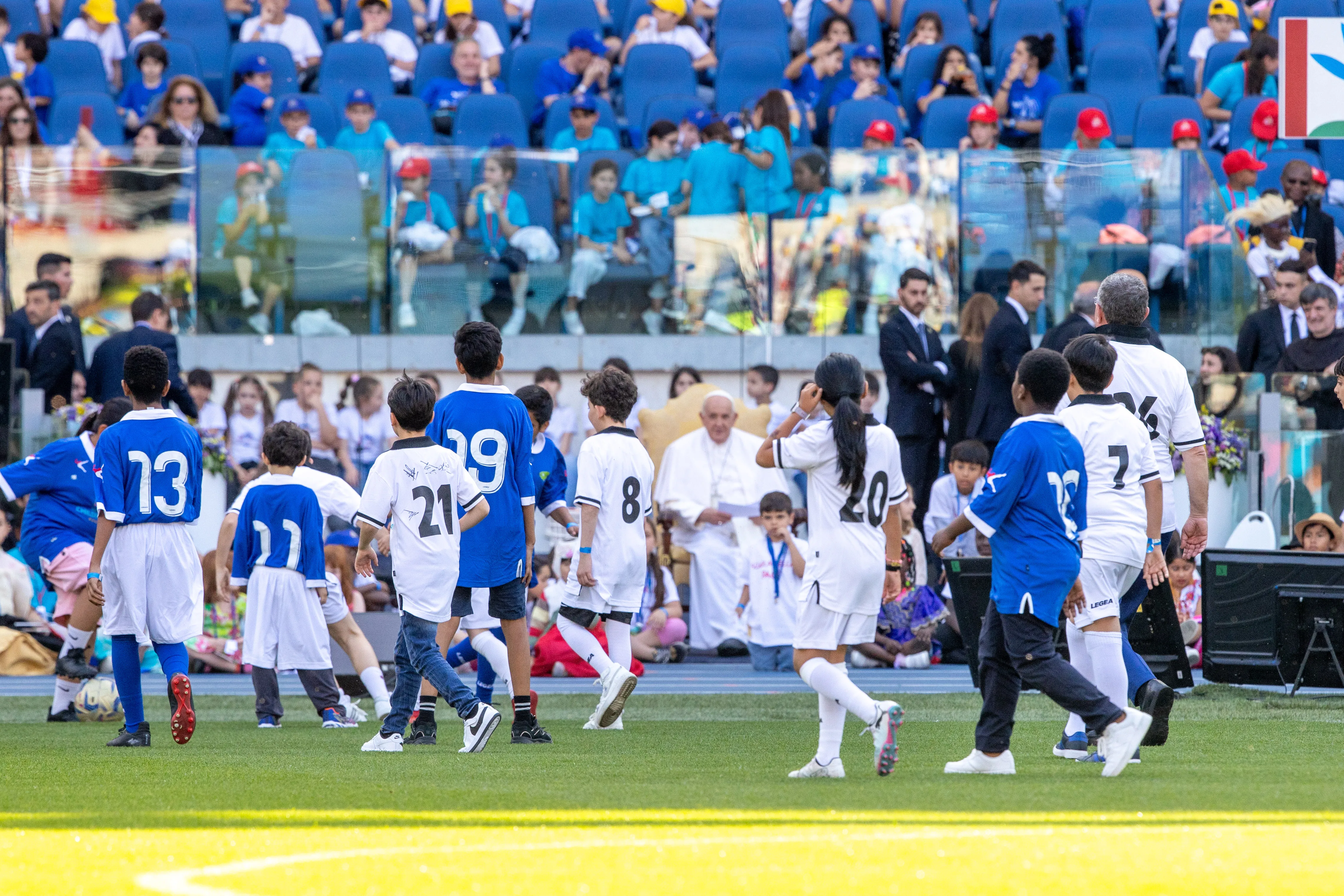 Pope Francis watches a friendly soccer game between Italian professional soccer players with children clad in uniforms as part of the first World Children’s Day on May 25, 2024, at Olympic Stadium in Rome.?w=200&h=150