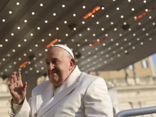 Pope Francis waves to pilgrims gathered in St. Peter’s Square for his Wednesday general audience on Dec. 4, 2024.